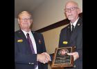 New NSVFA President Dell Cerny (left) presented a plaque to outgoing President Jim Horn.