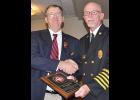 Jim Horn (right) presented outgoing secretary-treasurer Bill Lundy with a plaque. Lundy served the association for 11 years.