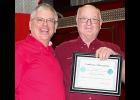 KSFFA Secretary Steve Hirsch (left) presents a certificate to Mankato Fire Chief Lloyd Johnson in honor of 41 years of service to the Mankato Fire Department at a reception held at the Mankato Fire Station on Jan. 10.