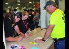 Bill Lundy helps people register at Nebraska Fire School.