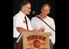 President Charlie Kludt presented Governor Daugaard with a 2015 Pierre Fire School Challenge coin.