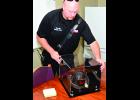 A leather fire fighter’s helmet and badge dating back to the 1950s were returned by the 1st Infantry Division Museum to the Fort Riley Fire Department’s Station Two Oct. 4.