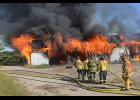 A total of five buildings were taken down in a controlled burn on Sept. 20 in Gilbertville.  Photo by Lowell Abarr.