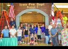 Volunteers helped set up the IFA Hall of Flame at the Iowa State Fair last month. Photos by Jack Runge.	