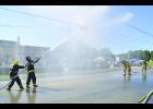 Nashua (left) battles Riverdale in the Championship match of the Drill #10, Water Application Drill, at the 140th annual Iowa Firefighters Convention held in Waverly Sept. 5-9. Riverdale went on to win. 