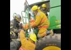 Firefighters practice rescue skills in the Farm Rescue class at the fire school in Marion. Photo by Dan Romine.