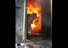 The burn trailer is getting stoked and ready for live fire evolutions at the September fire school in Manhattan. Photo by Lacey Yordy.
