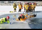 Firefighters from Montezuma, Deep River, New Sharon and Malcom braved cold water as they learned rescue methods in ice using up-to-date equipment and techniques that provide maximum security to both the rescuer and the victim in the water. They trained on Lake Ponderosa on Jan. 19. In the photo above, firefighters had a little fun sliding on the ice. See more photos and story inside. Photo by Dann Hayes.