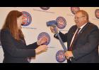 	Scott Schremmer presented incoming NSVFA President Brendy Jenny with an extra large gavel, noting she may need it to keep secretary-treasurer Mark Meints in line.