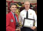 Mark McNees (left), President of the Iowa Firefighters Association, presented a 30-year award to Kevin Walcott of the Red Oak Fire Department.