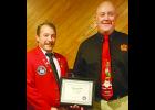 	IFA President Marv Trimble (left) presented Mike Barron with a certificate. Barron is retiring after 33 years with the Vinton Fire Department.	